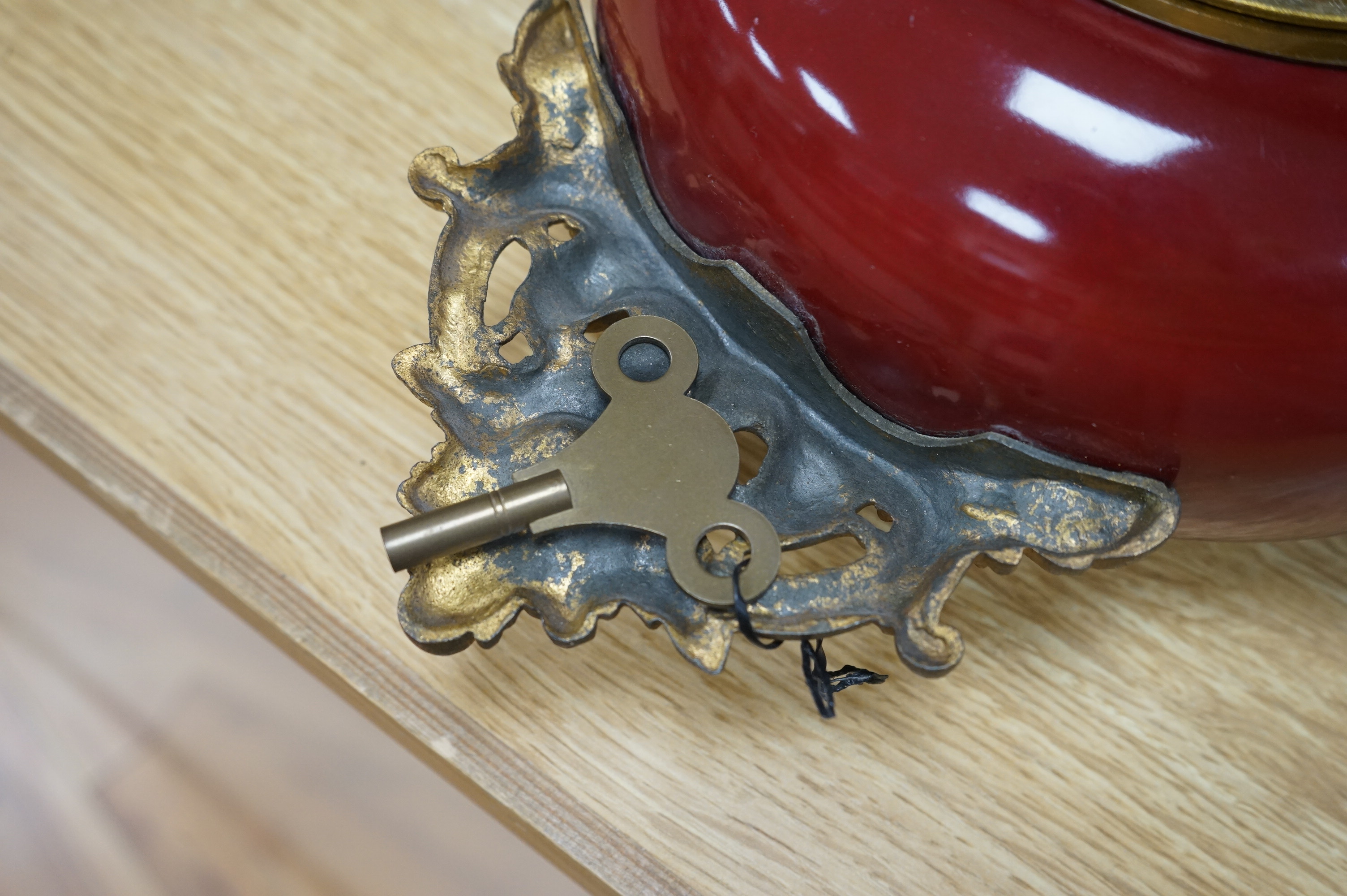 A late 19th century French hanging enamel and gilt metal wall clock. 38cm high without chain. Condition - fair to good